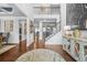 Elegant foyer with hardwood floors, a staircase, and stylish decor at 6917 Demeter Dr, Atlanta, GA 30349