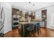 Well-equipped kitchen featuring dark wood cabinets, stainless steel appliances, and a central island at 6917 Demeter Dr, Atlanta, GA 30349