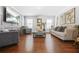 Spacious living room with hardwood floors, modern decor, and ample seating at 6917 Demeter Dr, Atlanta, GA 30349