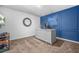 Office space featuring a large desk, custom blue accent wall, and modern decor at 6917 Demeter Dr, Atlanta, GA 30349