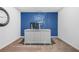 Office space featuring a large desk, custom blue accent wall, and modern decor at 6917 Demeter Dr, Atlanta, GA 30349