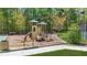 Community playground featuring play structures, benches, and a safety-conscious ground cover at 6917 Demeter Dr, Atlanta, GA 30349