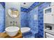 Unique bathroom design featuring a stylish vanity, blue tile, and modern fixtures at 1015 S Candler St, Decatur, GA 30030