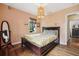 Cozy bedroom with hardwood floors, neutral walls, and a window with natural light at 1015 S Candler St, Decatur, GA 30030
