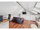 Open bonus room features skylight, hardwood floors, living and work spaces at 1015 S Candler St, Decatur, GA 30030