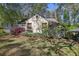 Charming home exterior with flowering plants, landscaping, and inviting curb appeal at 1015 S Candler St, Decatur, GA 30030