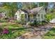 Charming home boasts mature landscaping and a cozy front porch, perfect for relaxing outdoors at 1015 S Candler St, Decatur, GA 30030