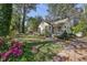 Charming home boasts mature landscaping and a cozy front porch, perfect for relaxing outdoors at 1015 S Candler St, Decatur, GA 30030