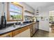 Well-lit kitchen featuring sleek countertops, updated appliances and hardwood floors at 1015 S Candler St, Decatur, GA 30030
