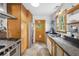 Functional kitchen with stainless steel appliances, ample counter space, and a unique round window door at 1015 S Candler St, Decatur, GA 30030