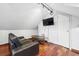 Cozy living area features hardwood floors and a wall-mounted television at 1015 S Candler St, Decatur, GA 30030