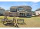 Large fenced yard with a patio area, perfect for entertaining and enjoying outdoor living at 2881 Terra View Sw Dr, Lilburn, GA 30047