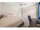 A bedroom features a bed, a work area and a double closet at 2881 Terra View Sw Dr, Lilburn, GA 30047