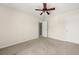 A neutral bedroom featuring carpeted floors and a ceiling fan for added comfort at 2881 Terra View Sw Dr, Lilburn, GA 30047