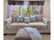 Sitting room with a comfortable sofa and a window overlooking the yard at 2881 Terra View Sw Dr, Lilburn, GA 30047