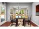 Cozy dining area with natural light and stylish rug adjacent to outdoor entry at 2881 Terra View Sw Dr, Lilburn, GA 30047