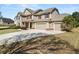 Spacious home with a large driveway, three-car garage and manicured landscaping at 2881 Terra View Sw Dr, Lilburn, GA 30047