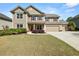 Charming two-story home with a well-maintained lawn and a three-car garage at 2881 Terra View Sw Dr, Lilburn, GA 30047