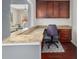 Functional home office with custom built-ins and granite countertops, open to the living space at 2881 Terra View Sw Dr, Lilburn, GA 30047