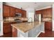 Spacious kitchen with a large island, stainless steel appliances, and granite countertops at 2881 Terra View Sw Dr, Lilburn, GA 30047
