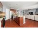 Open-concept kitchen with stainless steel appliances, granite countertops, and an island at 2881 Terra View Sw Dr, Lilburn, GA 30047
