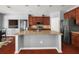 Kitchen with granite island, stainless appliances, and ample cabinet space at 2881 Terra View Sw Dr, Lilburn, GA 30047