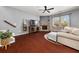 Bright living room with stone fireplace, hardwood floors, and modern furniture at 2881 Terra View Sw Dr, Lilburn, GA 30047