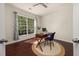 Bright home office with desk and large windows offering a view to the outside at 2881 Terra View Sw Dr, Lilburn, GA 30047