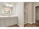 Bathroom features modern vanity, mirror and walk-in shower with clear glass door at 3314 Tiara Cir, Atlanta, GA 30311