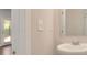 Well-lit bathroom with a modern sink, mirror, and an open doorway to the living area at 3314 Tiara Cir, Atlanta, GA 30311