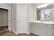 Bathroom features modern vanity, mirror, and an open doorway to the closet at 3314 Tiara Cir, Atlanta, GA 30311