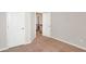 Neutral bedroom with carpeting, a closet, and access to the upper floor of the house at 3314 Tiara Cir, Atlanta, GA 30311
