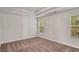 Comfortable bedroom with neutral walls, trey ceiling and natural light from two windows at 3314 Tiara Cir, Atlanta, GA 30311