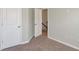 A cozy carpeted bedroom featuring neutral walls, creating a serene and comfortable space at 3314 Tiara Cir, Atlanta, GA 30311