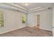 Spacious bedroom with two windows, trey ceiling and an open doorway at 3314 Tiara Cir, Atlanta, GA 30311