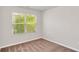 Bright bedroom with a window offering natural light and views of the surrounding greenery at 3314 Tiara Cir, Atlanta, GA 30311