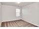 Bright, carpeted bedroom featuring a window allowing natural light at 3314 Tiara Cir, Atlanta, GA 30311