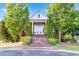 Stately home entrance with a brick walkway, manicured shrubbery, and grand front doors at 3314 Tiara Cir, Atlanta, GA 30311