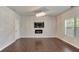 Inviting living room featuring hardwood floors, modern lighting, and a cozy fireplace at 3314 Tiara Cir, Atlanta, GA 30311