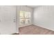 Bright room with neutral carpet, a large window, and white door, perfect for an office or bedroom at 3314 Tiara Cir, Atlanta, GA 30311