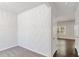 Room features neutral carpet, bright, marble-patterned accent wall and hardwood floors in the adjacent room at 3314 Tiara Cir, Atlanta, GA 30311