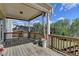 Enjoy outdoor living on this spacious wooden deck with decorative flower pots and a view at 4349 Northmark Ln, Buford, GA 30518