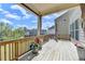 Enjoy outdoor living on this spacious wooden deck with decorative flower pots and a view at 4349 Northmark Ln, Buford, GA 30518