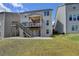 View of the backyard featuring a two-story deck and a patio for outdoor enjoyment at 4349 Northmark Ln, Buford, GA 30518