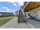 Backyard patio with a staircase to the upper deck and a seating area at 4349 Northmark Ln, Buford, GA 30518