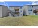 View of the backyard featuring a two-story deck and a patio for outdoor enjoyment at 4349 Northmark Ln, Buford, GA 30518