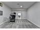 Finished basement area featuring neutral carpeting, offering a versatile space for recreation or relaxation at 4349 Northmark Ln, Buford, GA 30518