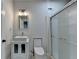 Modern bathroom showcasing a stand alone vanity, toilet, and enclosed glass shower at 4349 Northmark Ln, Buford, GA 30518