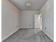 Minimalist bedroom featuring plush carpeting and neutral tones with a window and ample space at 4349 Northmark Ln, Buford, GA 30518