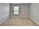 Bedroom featuring neutral paint, window, and carpet flooring at 4349 Northmark Ln, Buford, GA 30518